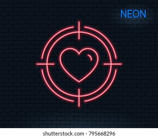Neon light. Heart in Target aim line icon. Love dating symbol. Valentines day sign. Glowing graphic design. Brick wall. Vector
