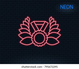 Neon light. Laurel wreath line icon. Winner medal symbol. Prize award sign. Glowing graphic design. Brick wall. Vector
