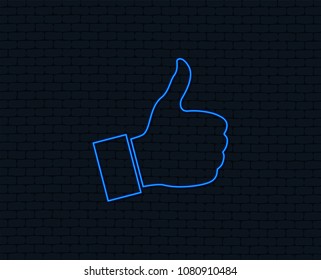 Neon light. Like sign icon. Thumb up sign. Hand finger up symbol. Glowing graphic design. Brick wall. Vector
