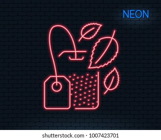 Neon light. Mint Tea bag line icon. Fresh herbal beverage sign. Mentha leaves symbol. Glowing graphic design. Brick wall. Vector