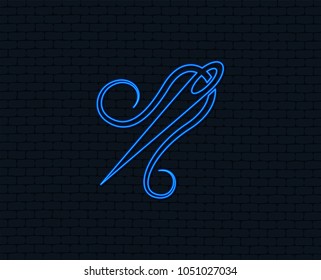 Neon light. Needle with thread icon. Tailor symbol. Textile sew up craft sign. Embroidery tool. Glowing graphic design. Brick wall. Vector