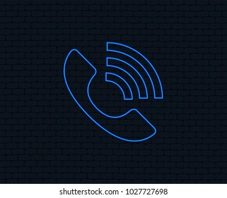 Neon light. Phone sign icon. Support symbol. Call center. Glowing graphic design. Brick wall. Vector