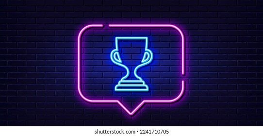 Neon light speech bubble. Award cup line icon. Winner Trophy symbol. Sports achievement sign. Neon light background. Award cup glow line. Brick wall banner. Vector