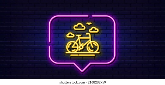 Neon light speech bubble. Bike rental line icon. Bicycle rent sign. Hotel service symbol. Neon light background. Bike rental glow line. Brick wall banner. Vector