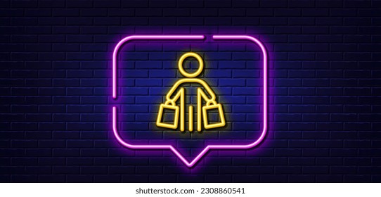 Neon light speech bubble. Buyer with shopping bags line icon. Customer sign. Supermarket client symbol. Neon light background. Buyer glow line. Brick wall banner. Vector