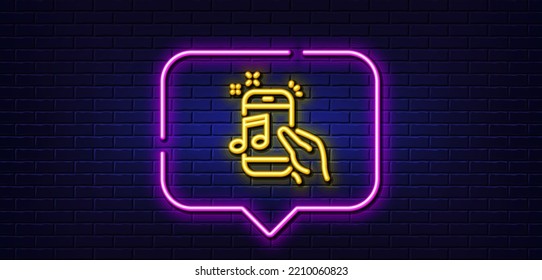 Neon light speech bubble. Music in phone line icon. Mobile radio sign. Musical device symbol. Neon light background. Music phone glow line. Brick wall banner. Vector