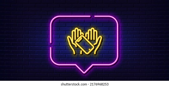 Neon light speech bubble. Smartphone holding line icon. Phone sign. Mobile device symbol. Neon light background. Smartphone holding glow line. Brick wall banner. Vector