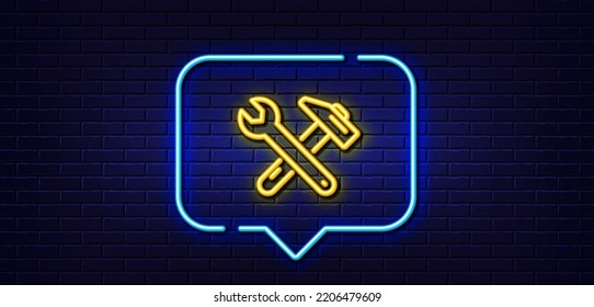 Neon light speech bubble. Spanner and hammer line icon. Repair service sign. Fix instruments symbol. Neon light background. Spanner tool glow line. Brick wall banner. Vector