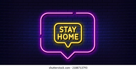 Neon light speech bubble. Stay home line icon. Coronavirus pandemic quarantine sign. Save lives symbol. Neon light background. Stay home glow line. Brick wall banner. Vector