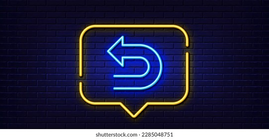 Neon light speech bubble. Undo arrow line icon. Left turn direction symbol. Navigation pointer sign. Neon light background. Undo glow line. Brick wall banner. Vector