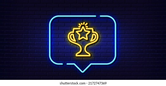 Neon light speech bubble. Winner cup line icon. Sport Trophy with Star symbol. Victory achievement or Championship prize sign. Neon light background. Victory glow line. Brick wall banner. Vector