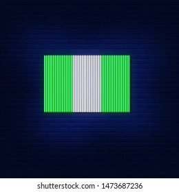 The neon lights of the flag of Nigeria. Bright advertising of the country. Modern vector logo, banner, shield, image of Nigeria flag. Night illustration against a brick wall.