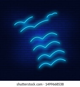 Neon lights flock of birds . Bright advertising of flying birds in the air. Modern vector logo, banner, shield, bird pattern high. Night advertising on the background of a brick wall.