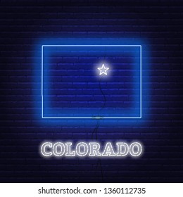 Neon map State of Colorado on a brick wall background.