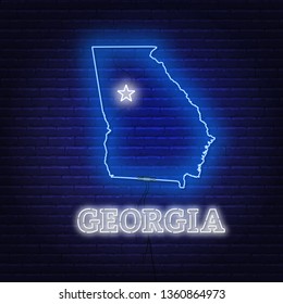 Neon map State of Georgia on a brick wall background.