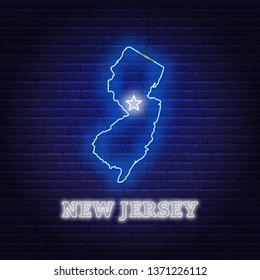Neon map State of New Jersey on a brick wall background.