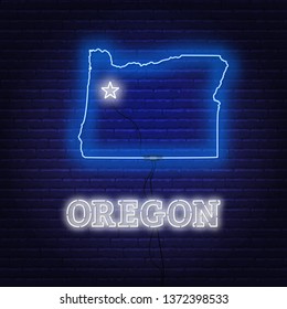 Neon map State of Oregon on a brick wall background.