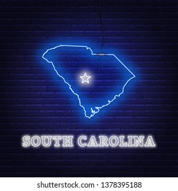 Neon map State of South Carolina on a brick wall background.