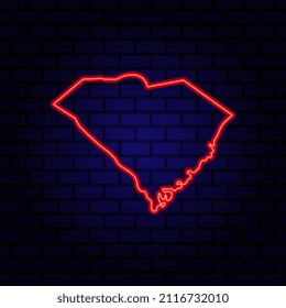 Neon map State of South Carolina on brick wall background.