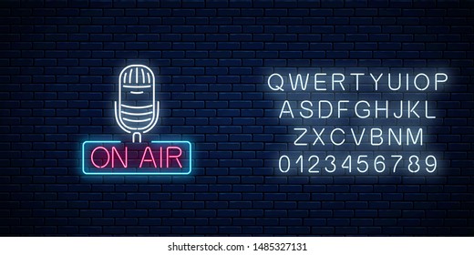 Neon on the air sign with microphone with alphabet on dark brick wall background. Glowing signboard of radio station. Sound cafe icon. Music show poster. Vector illustration.