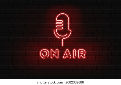 Neon On The Air Sign With Retro Microphone On Dark Brick Wall Background.