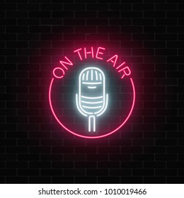 Neon On The Air Signboard With Microphone In Round Frame. Night Cafe With Live Music Icon. Glowing Street Sign Of Bar With Karaoke And Live Singers. Rock Show Poster. Vector Illustration.