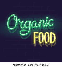 Neon organic food label for package, poster or web site. Isolated bright glowing handwritten text on brick wall background.