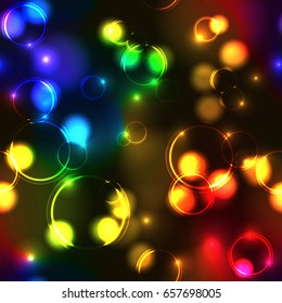 Neon rainbow bokeh effect seamless pattern. Dark background with Glowing sparkling circles and rings in spectrum colors. 