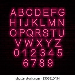 Neon red letters isolated on wall background. Vector glowing font. English alphabet.