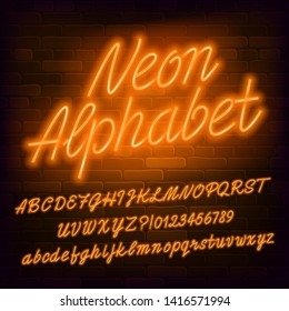 Neon script alphabet font. Orange neon color lowercase and uppercase letters and numbers. Brick wall background. Stock vector typescript for your typography design.