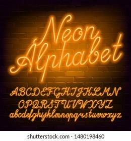 Neon script alphabet font. Yellow neon color lowercase and uppercase letters and numbers. Brick wall background. Stock vector typescript for your typography design.