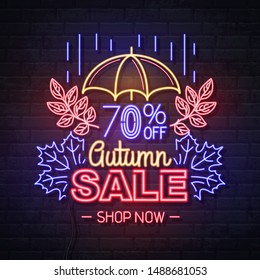 Neon sign autumn big sale with umbrella on brick background. Vintage electric signboard.