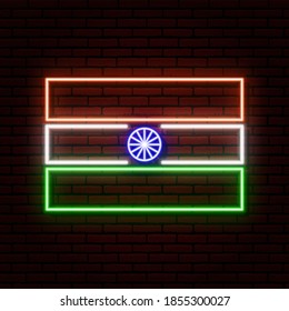 Neon sign in the form of the Indian flag. Against a brick wall with a shadow. For registration on tourist or Patriotic themes. White, orange, blue and green colors.