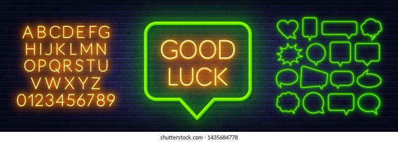 Neon sign good luck in speech bubble frame on dark background.Set of neon speech bubbles and the alphabet on a dark background. Template for design.