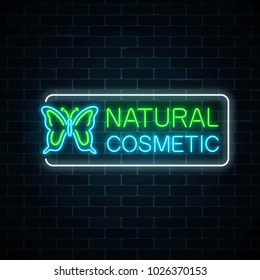 Neon sign of natural cosmetic production with butterfly on dark brick wall background. Organic cosmetology products glowing advertising symbol. Vector illustration.