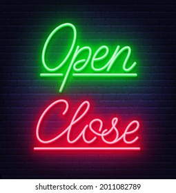 Neon sign open and close on brick wall background.