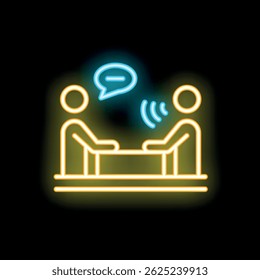 Neon sign representing two people sitting at a desk and talking, with a speech bubble, symbolizing communication and dialogue
