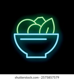 Neon sign of a salad bowl with lettuce and other vegetables glowing green and blue on a dark background