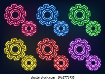 Neon sign. Set of neon gears setting in different colors. Glowing lines on a dark background.