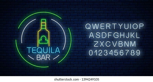 Neon sign of tequila bar in circle frames with alphabet on dark brick wall background. Mexican alcohol drink pub emblem in neon style. Vector illustration.