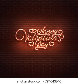 Neon sign, the word love on a brick wall background. Element for the St. Valentine's Day design. Can be used for greeting cards, banners.