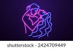 Neon silhouettes of a man and a woman kissing against a brick wall. A concept for a sex shop and erotica.