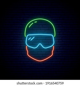 Neon Snowboarder icon. Glowing Snowboarder in hat and mask. Winter sport emblem. Vector illustration in neon style.