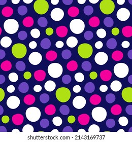 Neon spotted background. Polka dot pattern from handwritten circles. Bright print with neon green, pink, white dots on dark blue back. Speckled texture for design of modern wallpapers, covers, fabric.