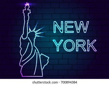 Neon statue of liberty with the inscription new York on a brick wall.