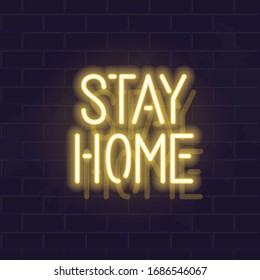 Neon stay home typography. Glowing vector motivation typography. Fluorescent letters on dark brick wall background.