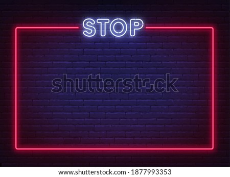 Neon stop sign in a frame on brick wall background. Prohibition template design.