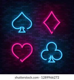 Neon Suit Poker and Casino on brick wall. Vector illustration.