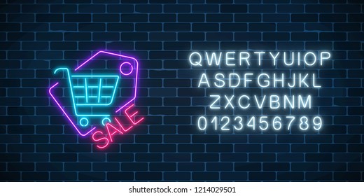 Neon supermarket sale sign with shopping cart in tag with alphabet on a dark brick wall background. Luminous advertising signboard. Neon light effects store basket. Vector illustration.