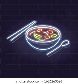 Neon tom yum bowl icon on brick wall background. Asian noodle soup. Vector isolated illustration for restaurant menu or flyer.